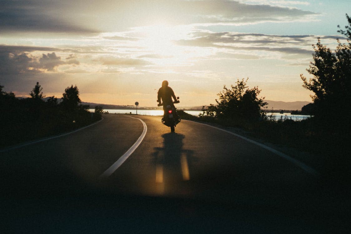 Motorcyclist riding on an open road