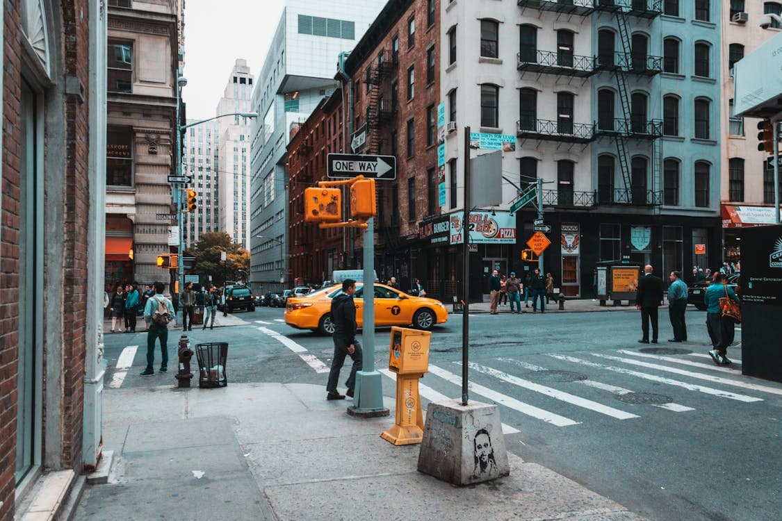 Person walking across an urban crosswalk