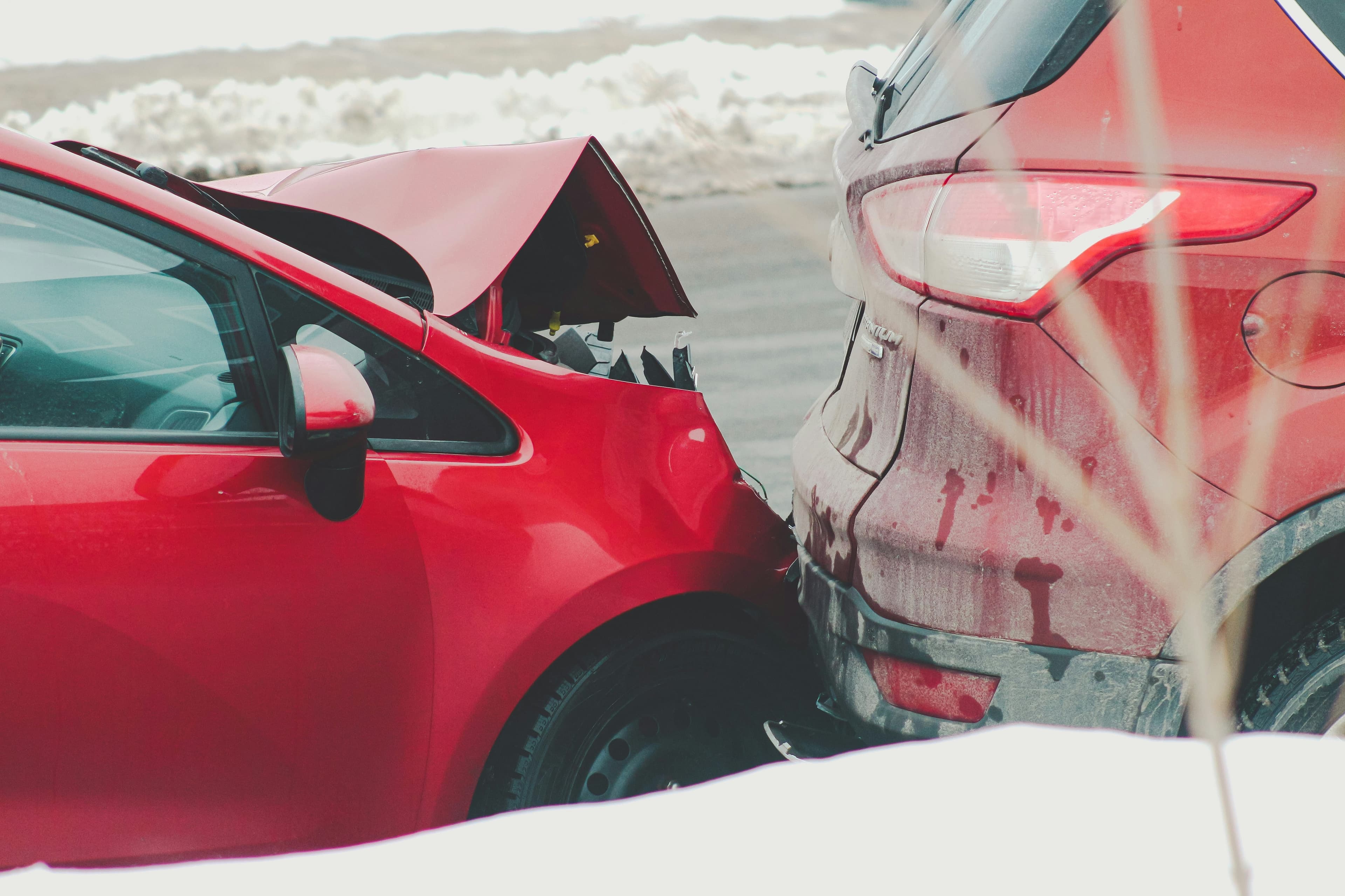 Two cars in a rear-end collision — the moment that triggers the insurance call