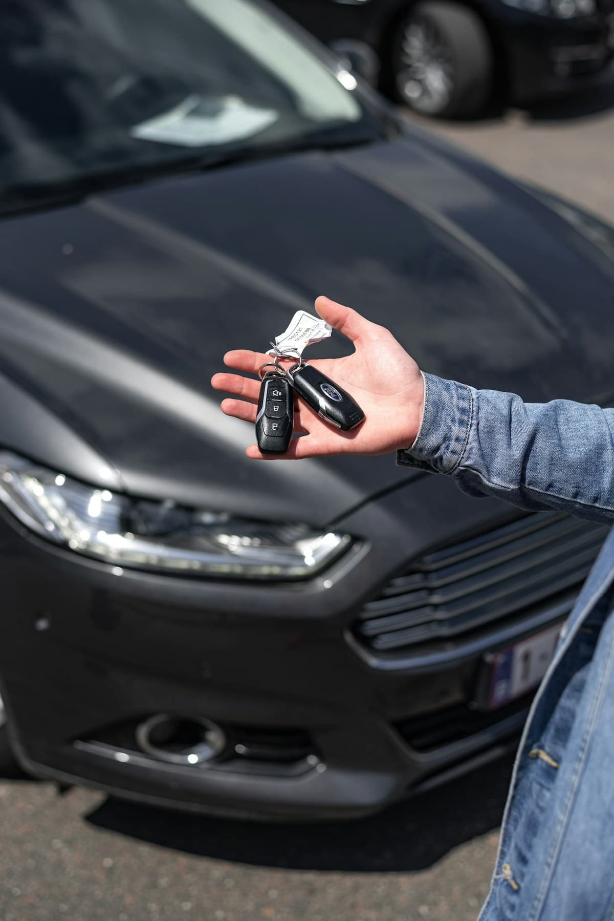 Person receiving car keys for rental vehicle after accident